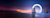 A serene beach sunset with two rock formations, one encircled by a glowing ring.