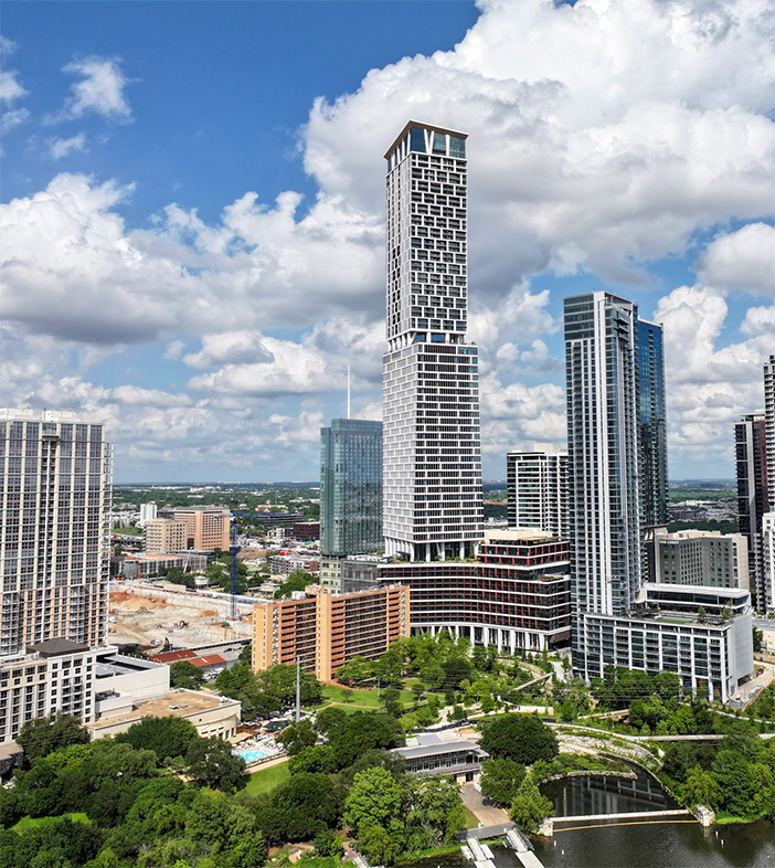 Skyscraper in Austin, Texas under a cloudy blue sky