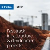 An aerial image of a construction site and road is overlaid with a blue, web-like digital network pattern.
