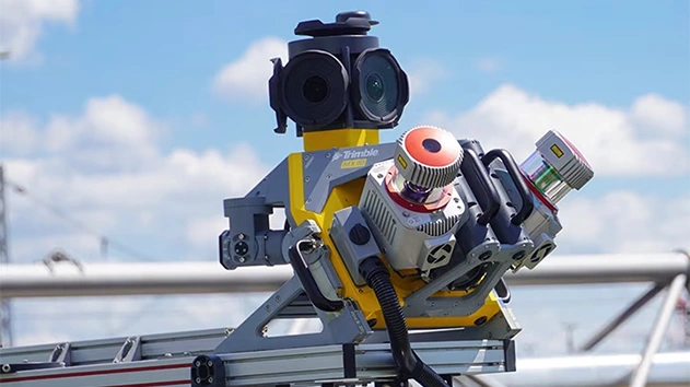 Close-up image of the Trimble MX90 on a car's roof rack