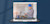 A laptop displays an image of an engineer in a hard hat using a tablet to digitally manage documents on a jobsite.