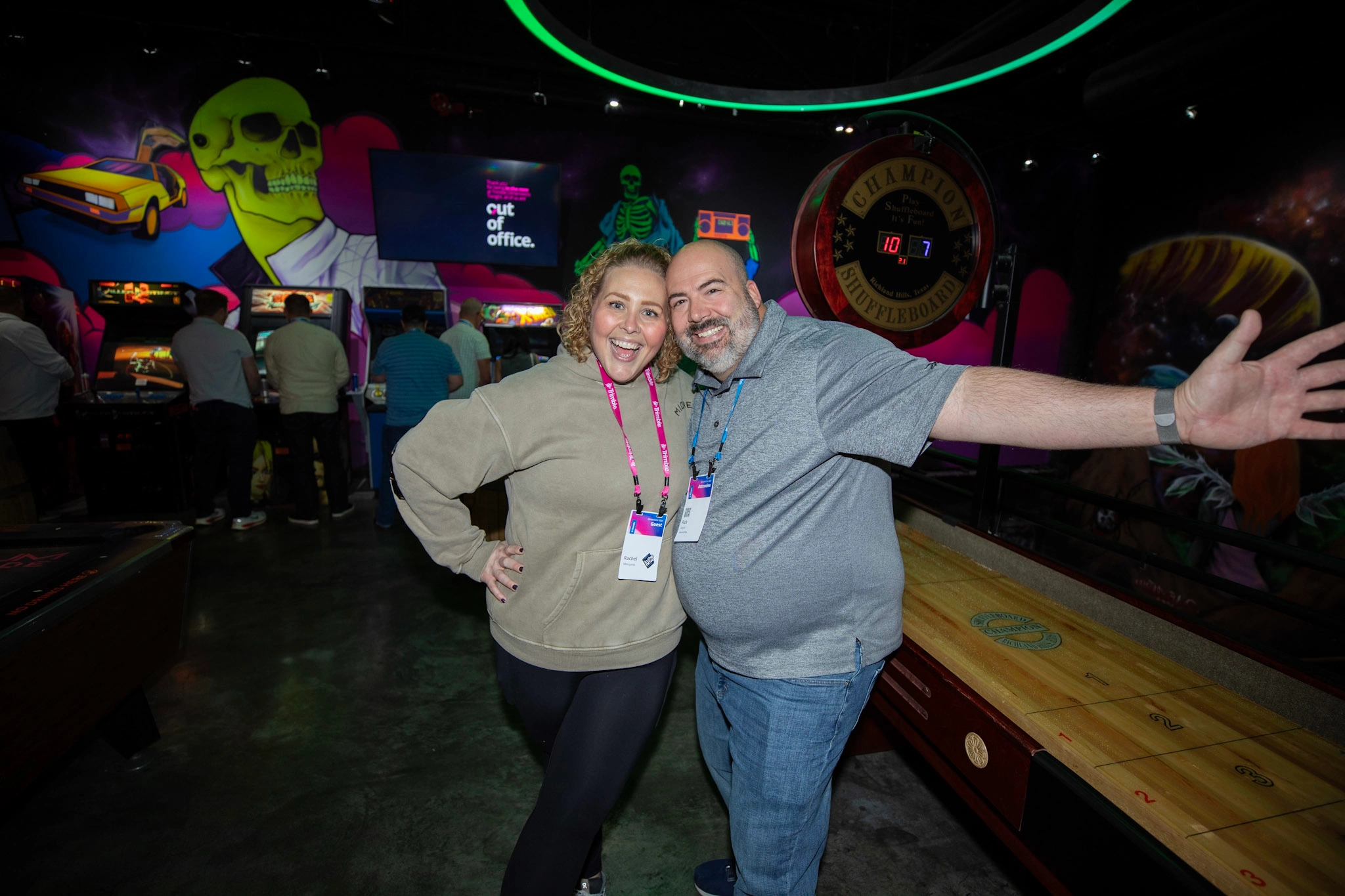 A Trimble Dimensions attendee and his guest smile for the camera at the Customer Appreciation Party at AREA15.