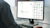 A person's hands are visible on a keyboard while a computer screen displays Trimble-managed ITM library