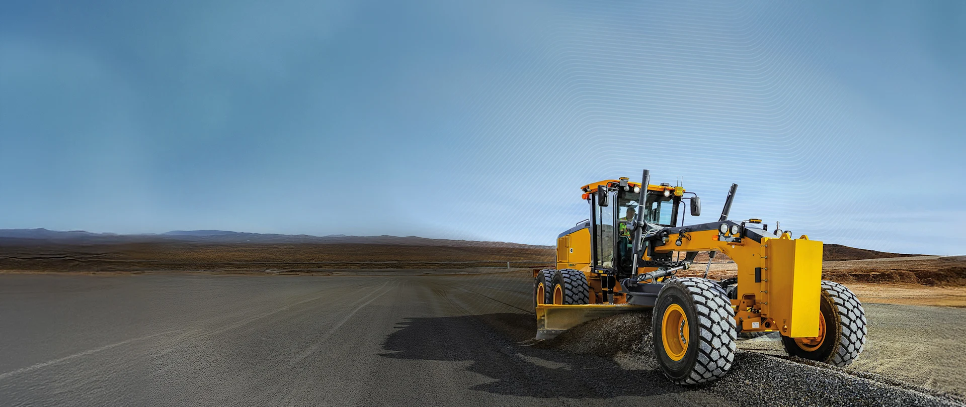Yellow motor grader leveling a road, featuring a digital grid representing Trimble Earthworks machine control technology.