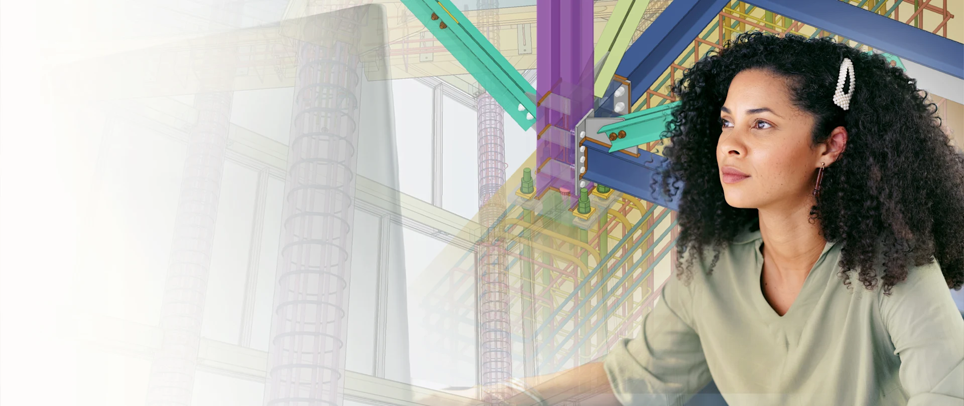 A woman works with a colorful 3D Trimble Tekla structural engineering model overlaid, representing BIM software in use.