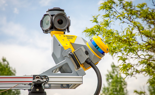 A monitor displaying a digital PPE Checklist with safety inspection categories for field equipment in a Trimble construction management app.