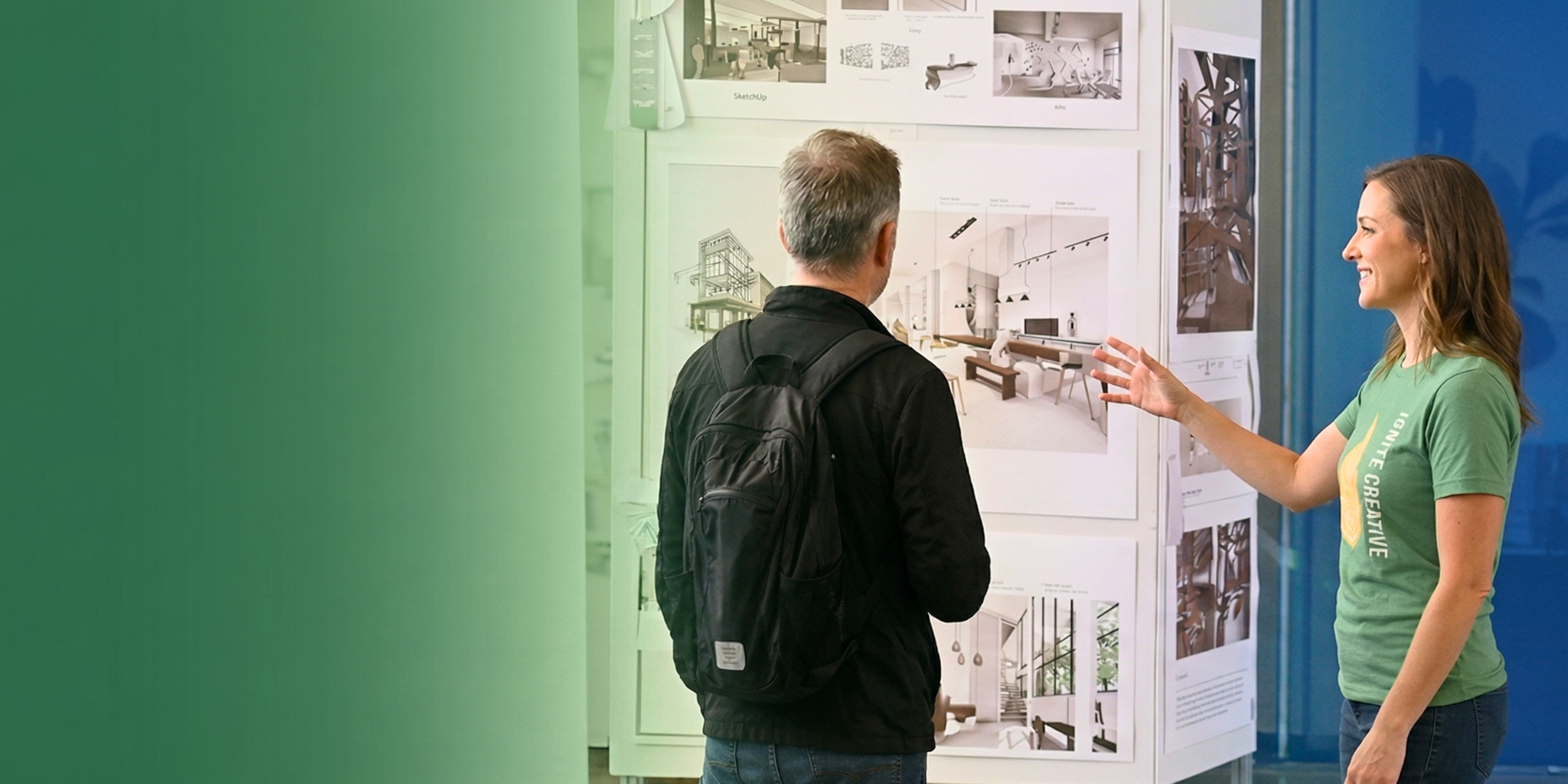 In a modern showroom, a woman wearing an "IGNITE CREATIVE" t-shirt gestures toward Trimble's SketchUp architectural designs while presenting to a man.