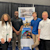 Young professionals smiling at camera at Trimble career event