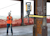Man using a robotic total station in a building