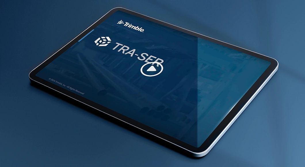A tablet displaying the Trimble TRA-SER logo and a play button, representing software for construction pricing and product data.