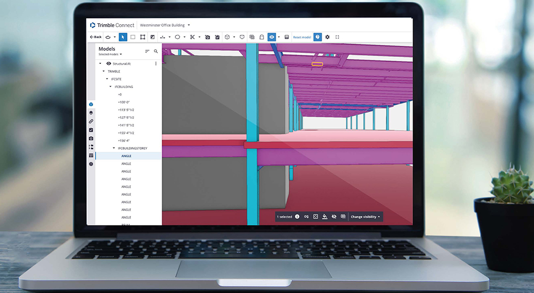 A laptop screen displaying a 3D structural model of the Westminster Office Building in Trimble Connect software, next to a small potted cactus.