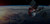 A digital rendering of several satellites orbiting Earth in the darkness of space.