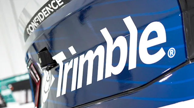 Close-up of a blue RFK Racing NASCAR car featuring the white Trimble logo and the "CONFIDENCE" tagline.