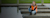 Woman in reflective vest and boots on dock smiling at camera using mobile device