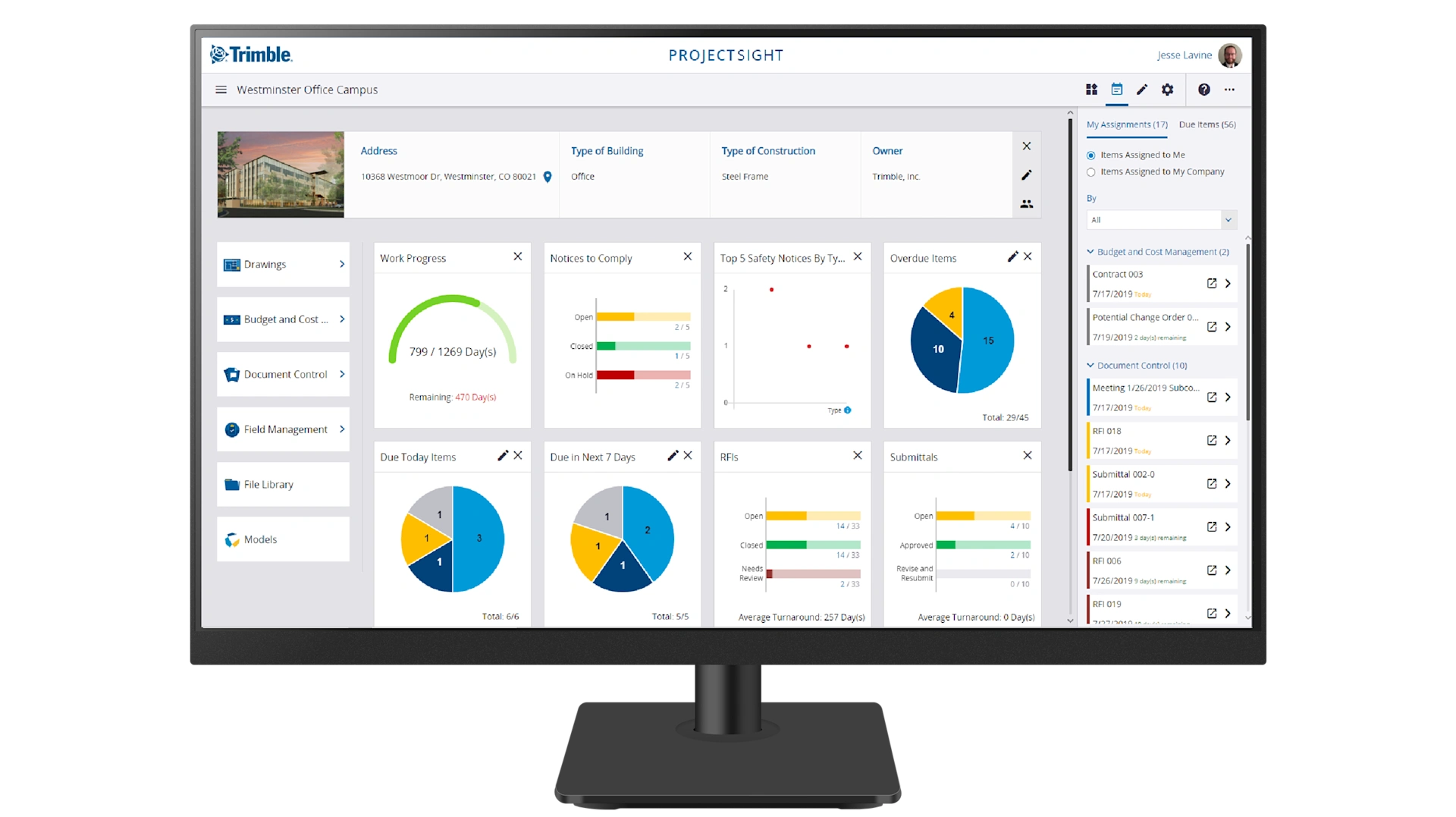A computer monitor displays the Trimble ProjectSight dashboard for a construction project at the company's Westminster, CO headquarters.