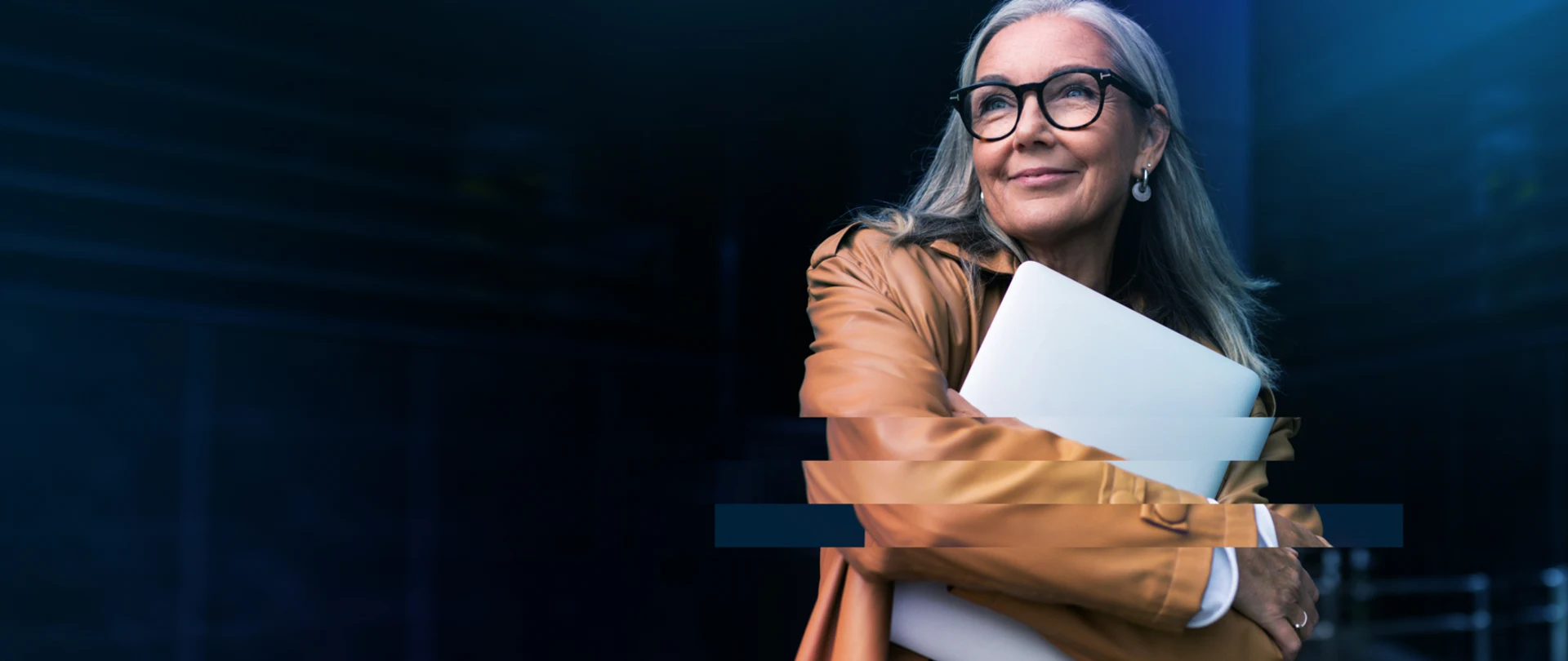 This banner image for Trimble features a professional woman with long grey hair and glasses holding a white laptop, with a digital glitch effect.