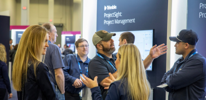 Many attendees network with each other on the Dimensions Expo floor.