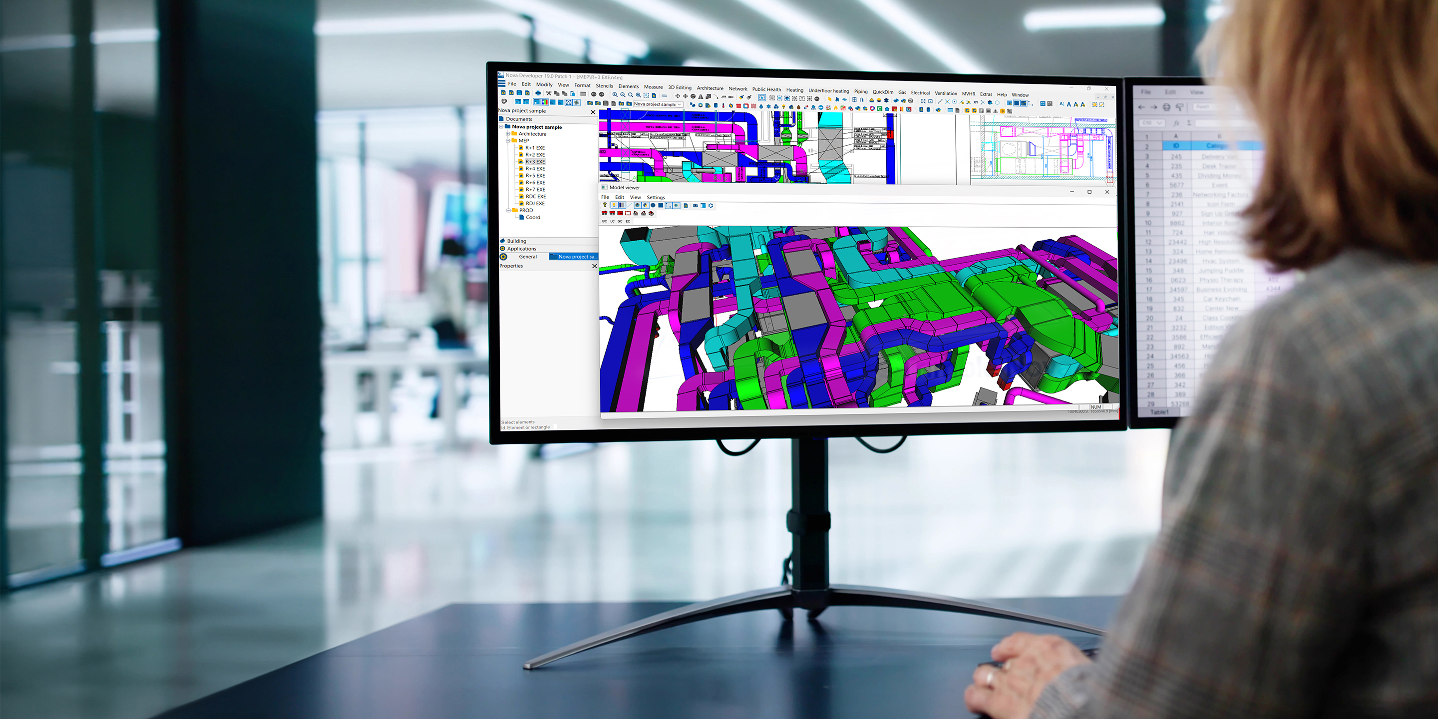An engineer works on a BIM model in Trimble Nova, showing a complex 3D view of colorful MEP ductwork and piping on a large monitor in a modern office.