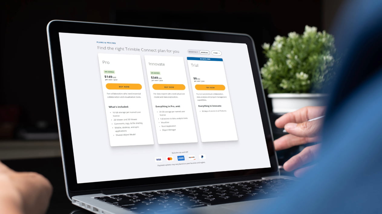 A laptop screen displaying three Trimble Connect pricing tiers: Pro, Innovate and a 30-day free Trial.