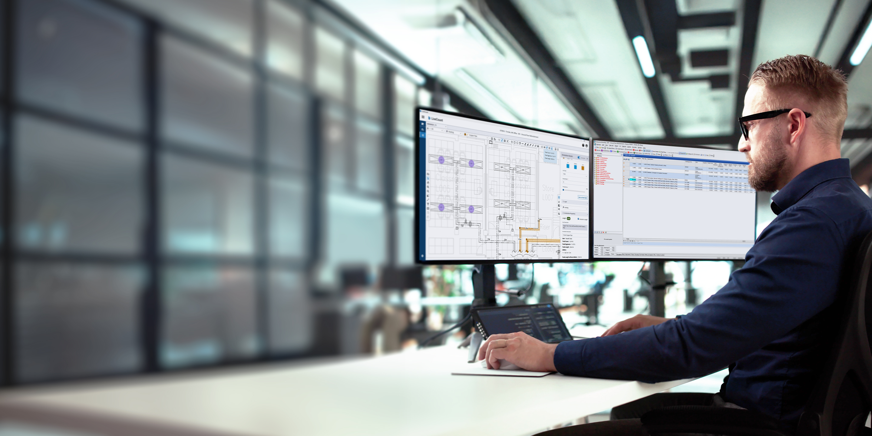 A man using Total Estimating software on dual monitors in a modern office.
