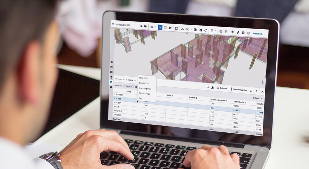 A professional uses Trimble Connect software on a laptop to analyze a 3D model and data table within a "Build Beyond BIM" project interface.