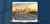 Laptop showing cars driving on highway with Dallas, Texas skyline at twilight