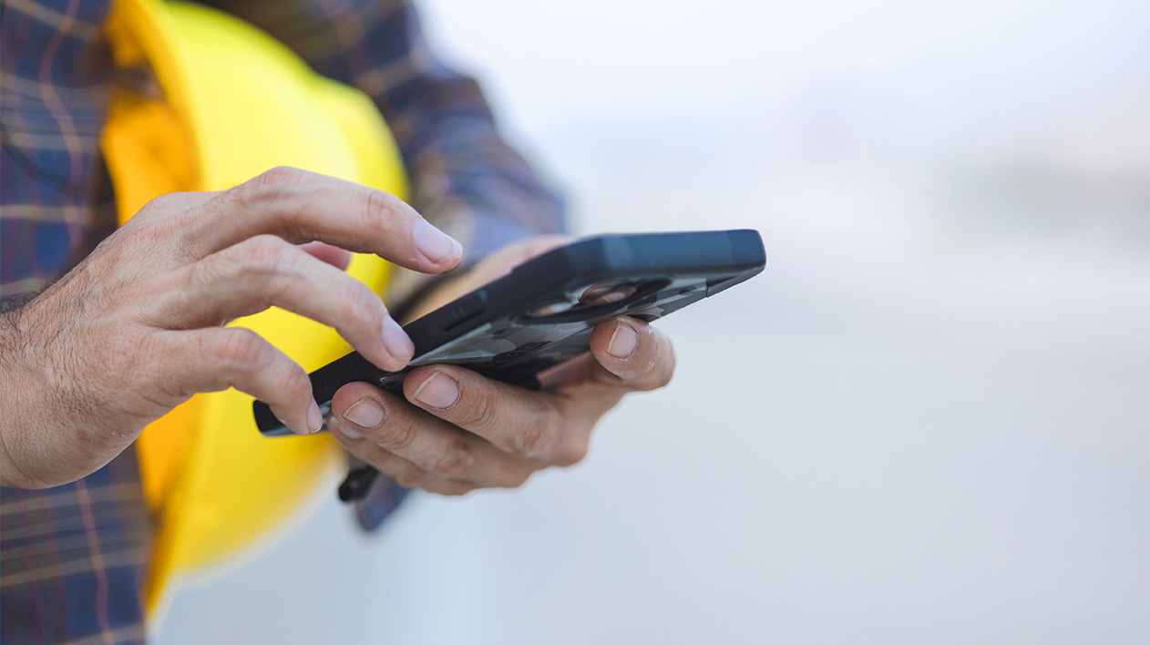 Person using a mobile construction procurement, inventory and supply chain management software