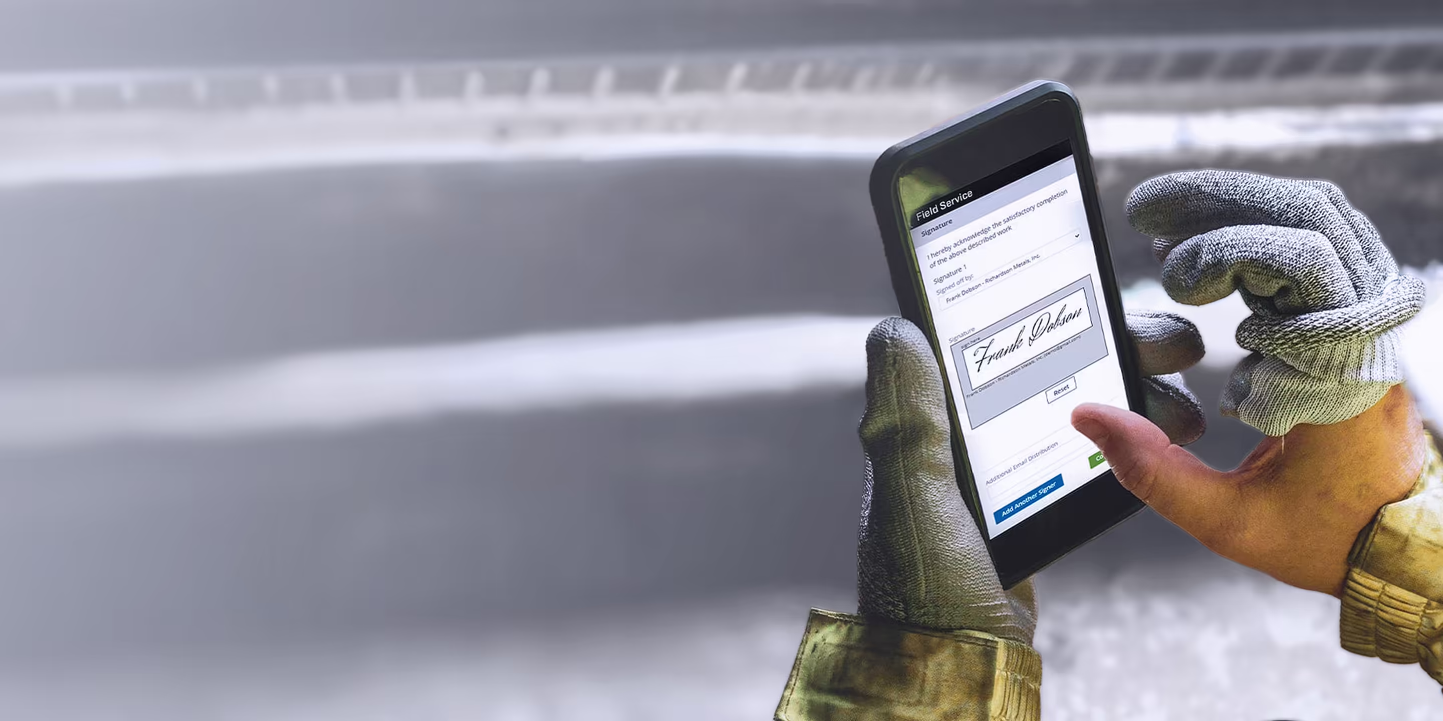 A technician wearing heavy-duty gloves uses the Trimble Vista Field Service app to capture a digital signature for work at Richardson Metals, Inc.