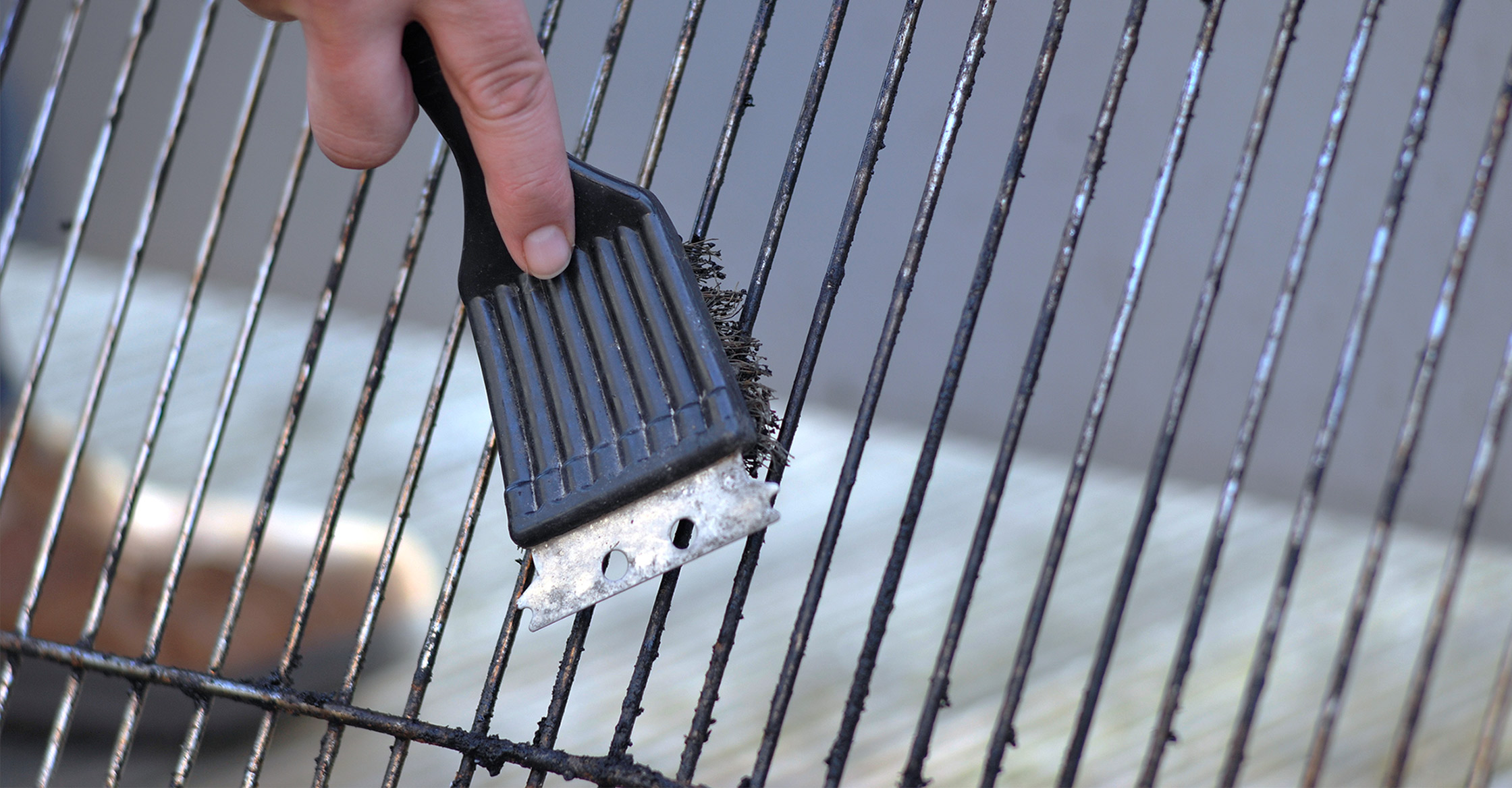 Cleaning Grill with Wire Brush