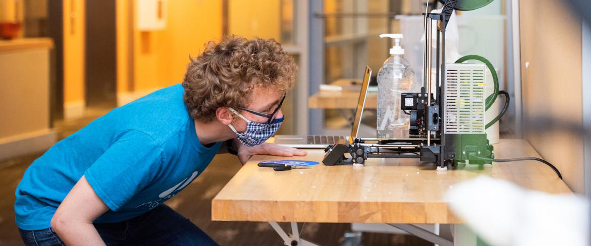 A student at Olin carefully observing their work.