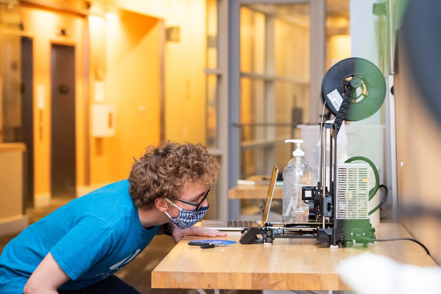 A student at Olin carefully observing their work.