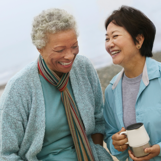 Two older adults smiling