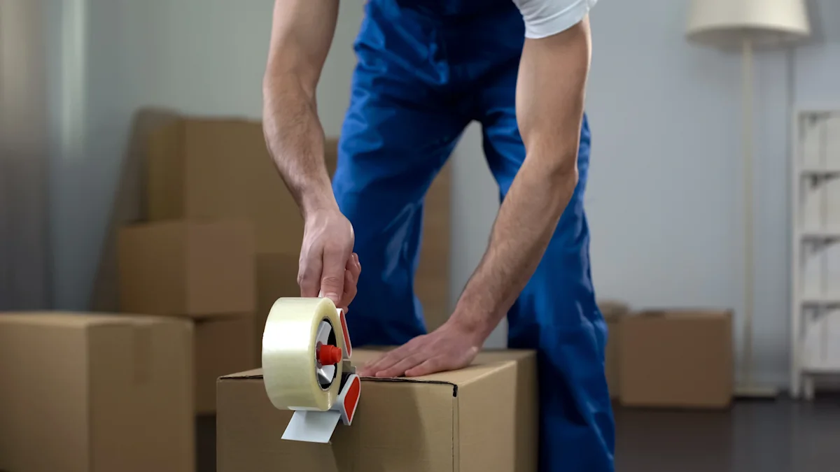 photo of a man taping a box for moving house