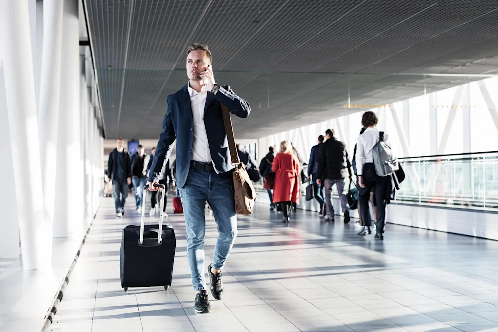 Man walking through airport gate