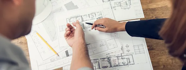 Architect discussing residential building plans with client