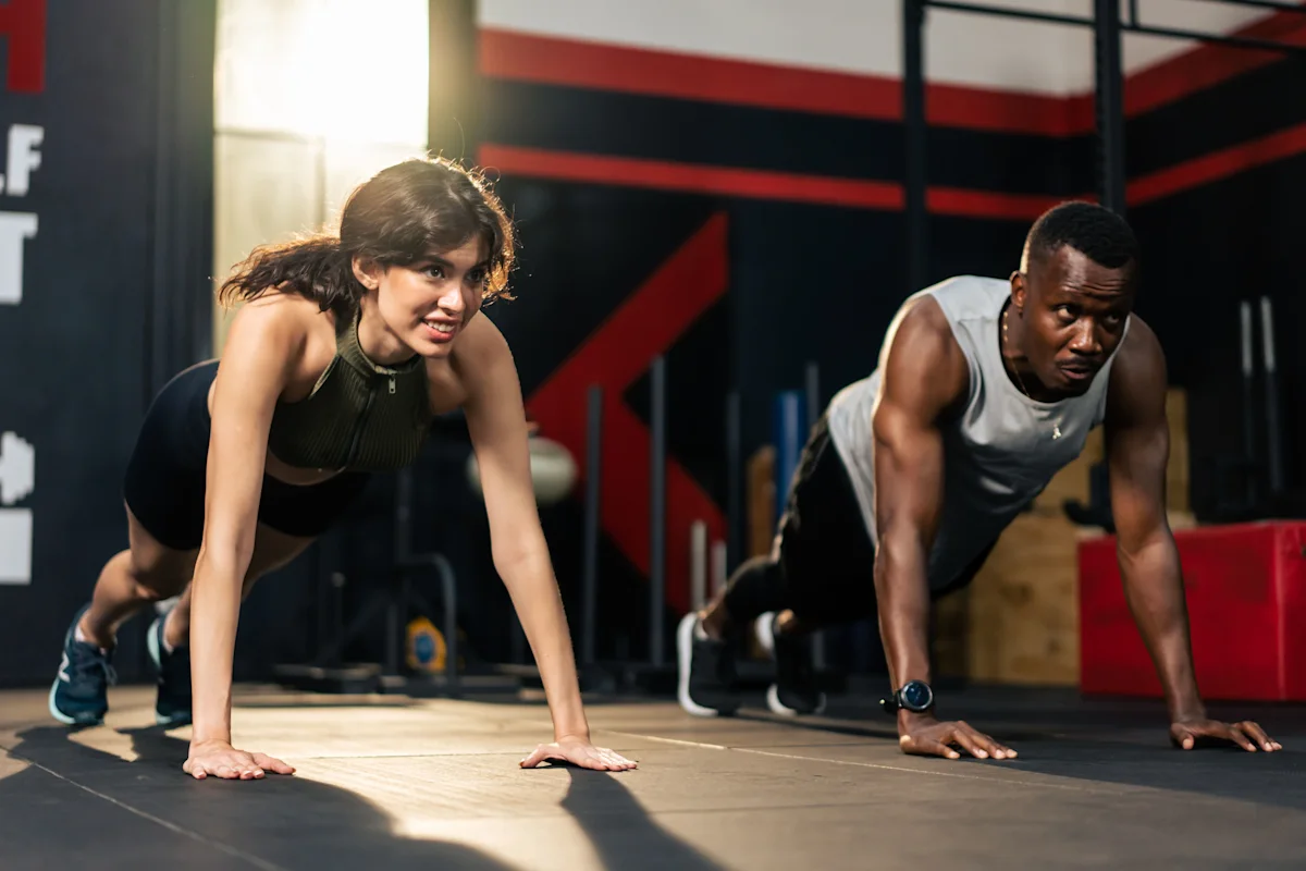 man and woman doing planks