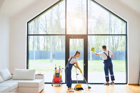 Cleaners working in a modern home