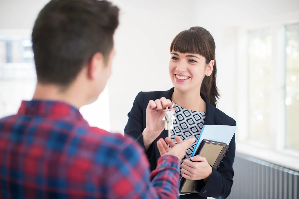 person collecting keys for new house
