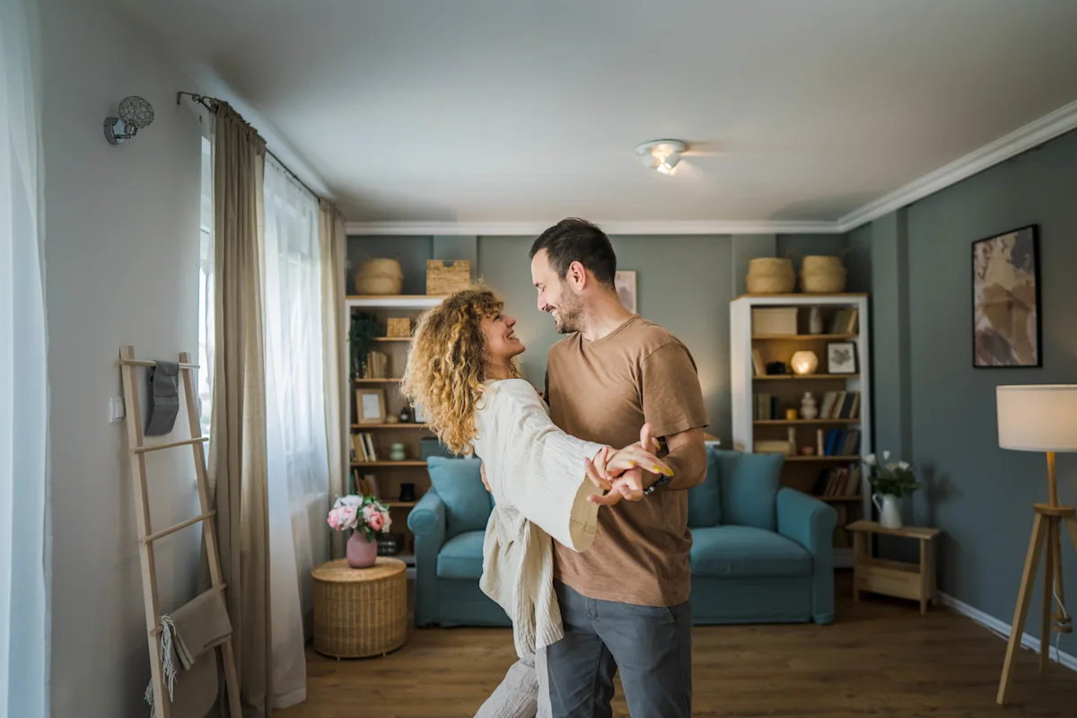 couple relaxed & dancing at home