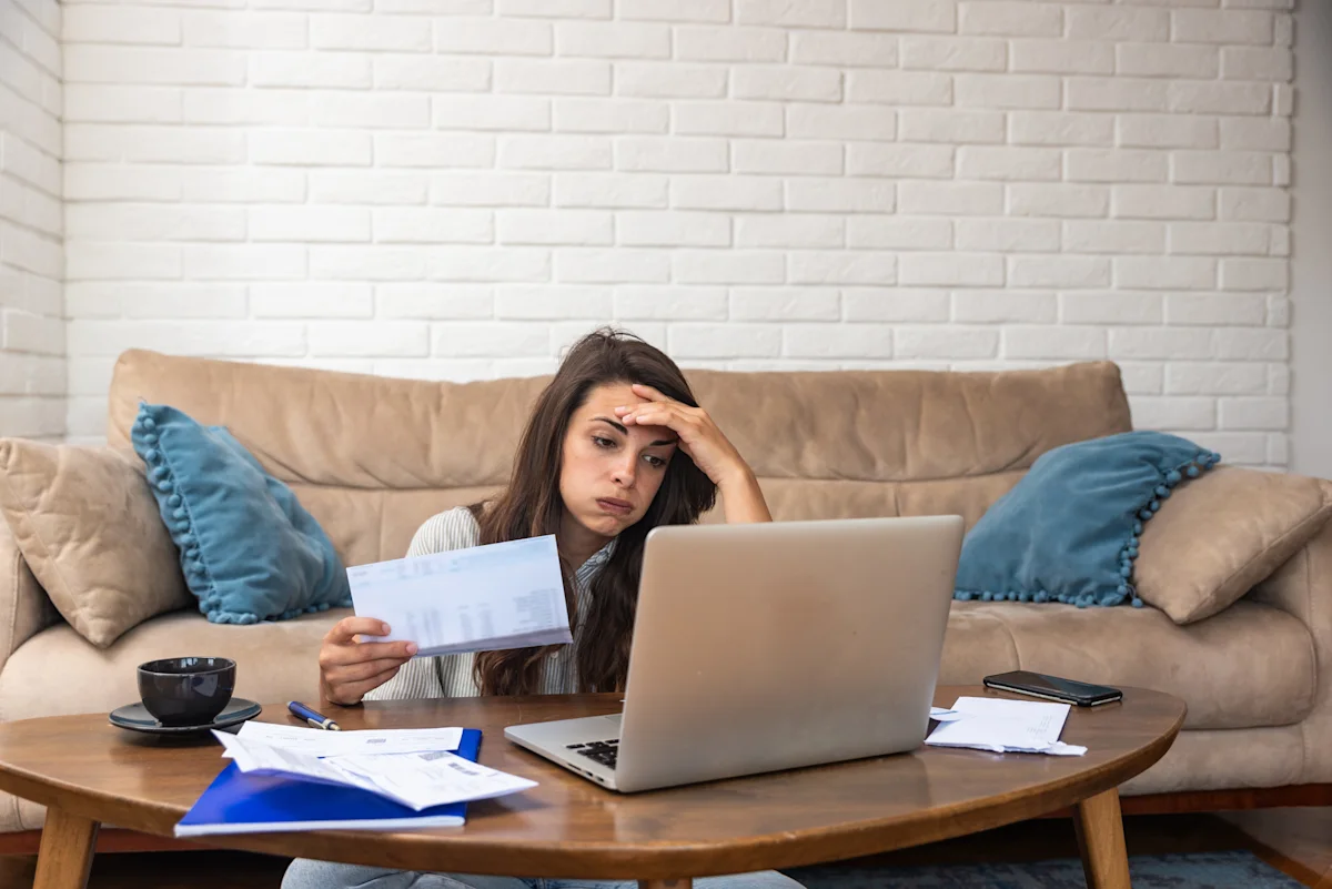 frustrated woman sitting in front of laptop