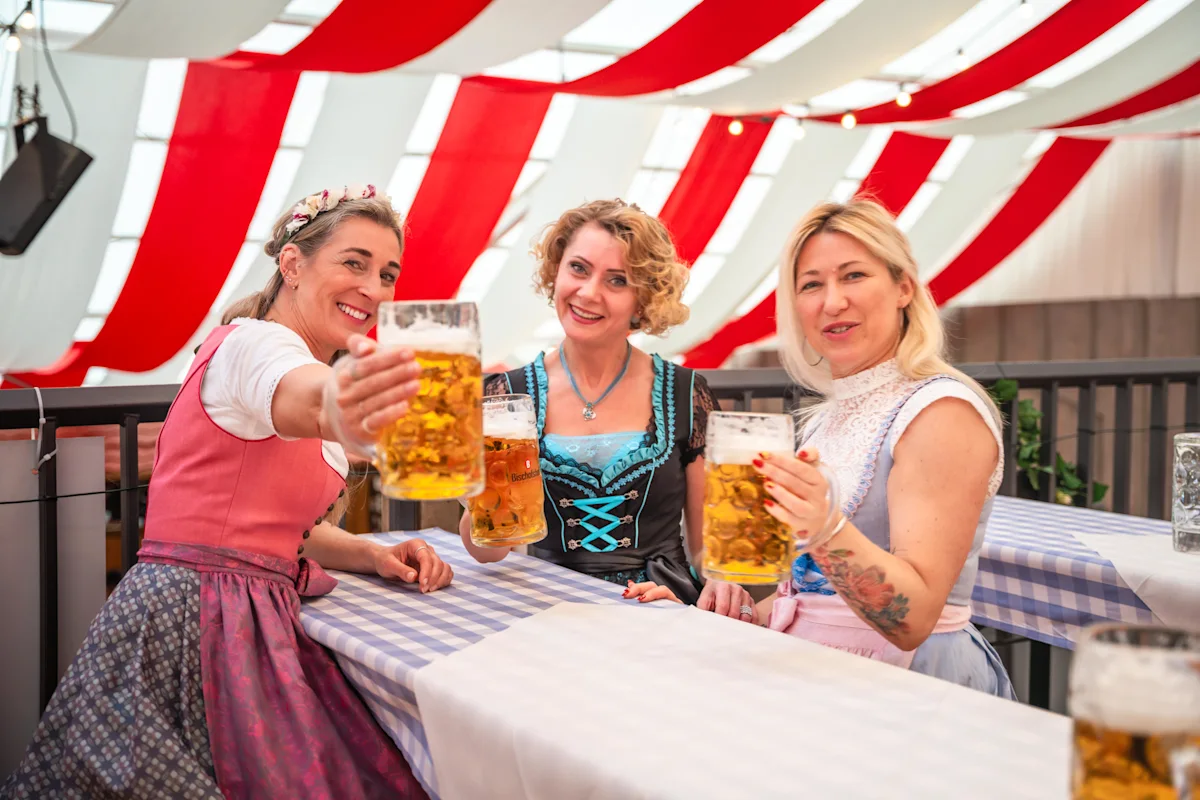 women drinking in a marquee