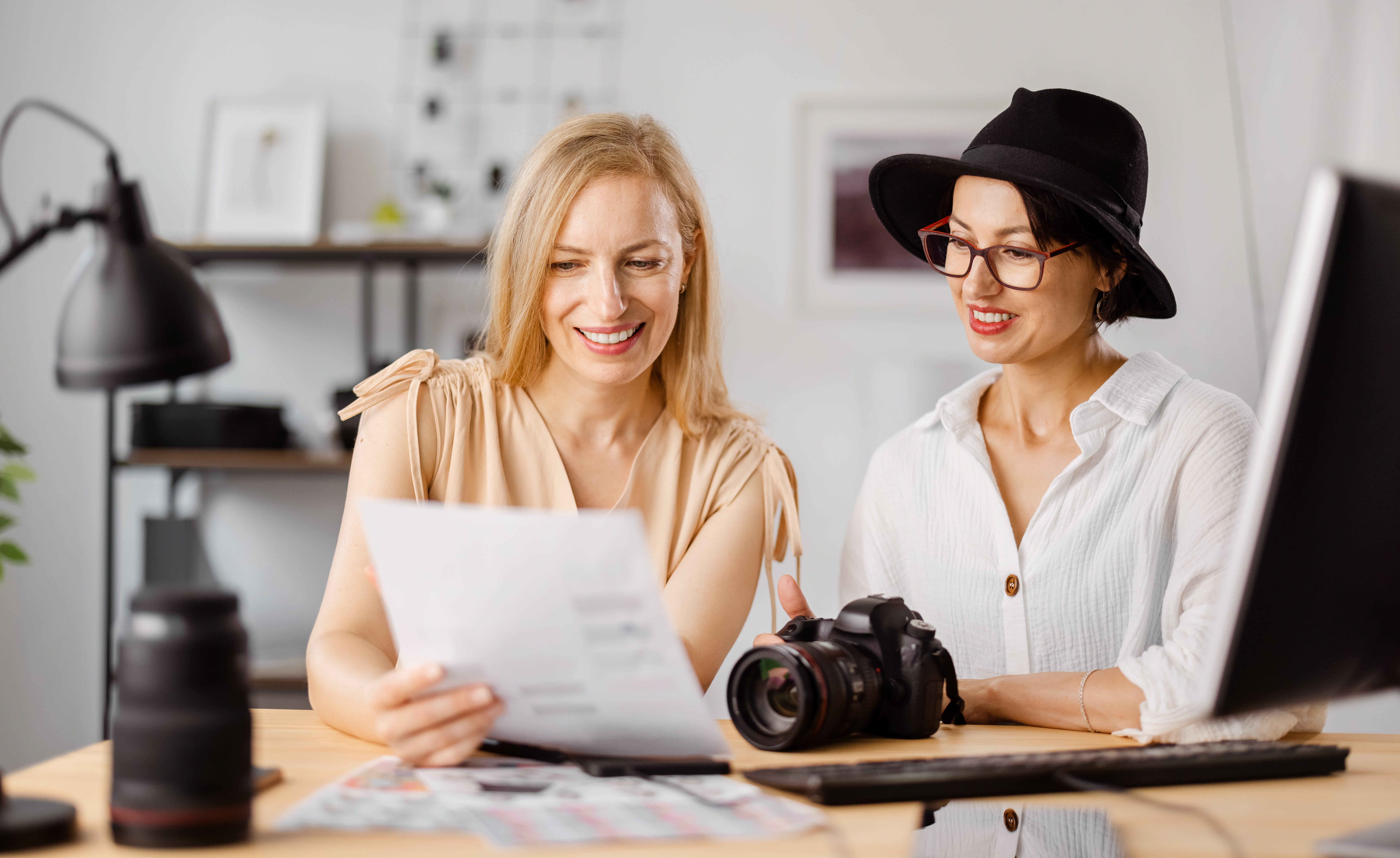 Photographer and client reviewing photos