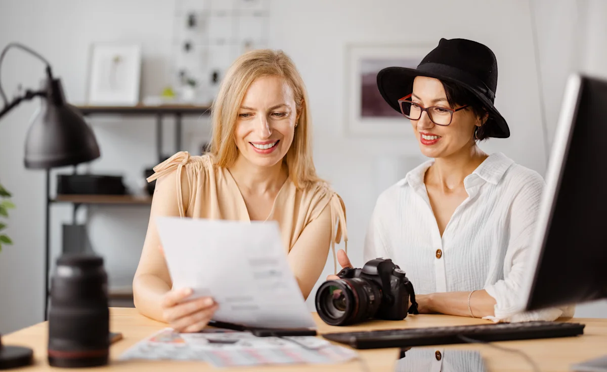 Photographer and client reviewing photos