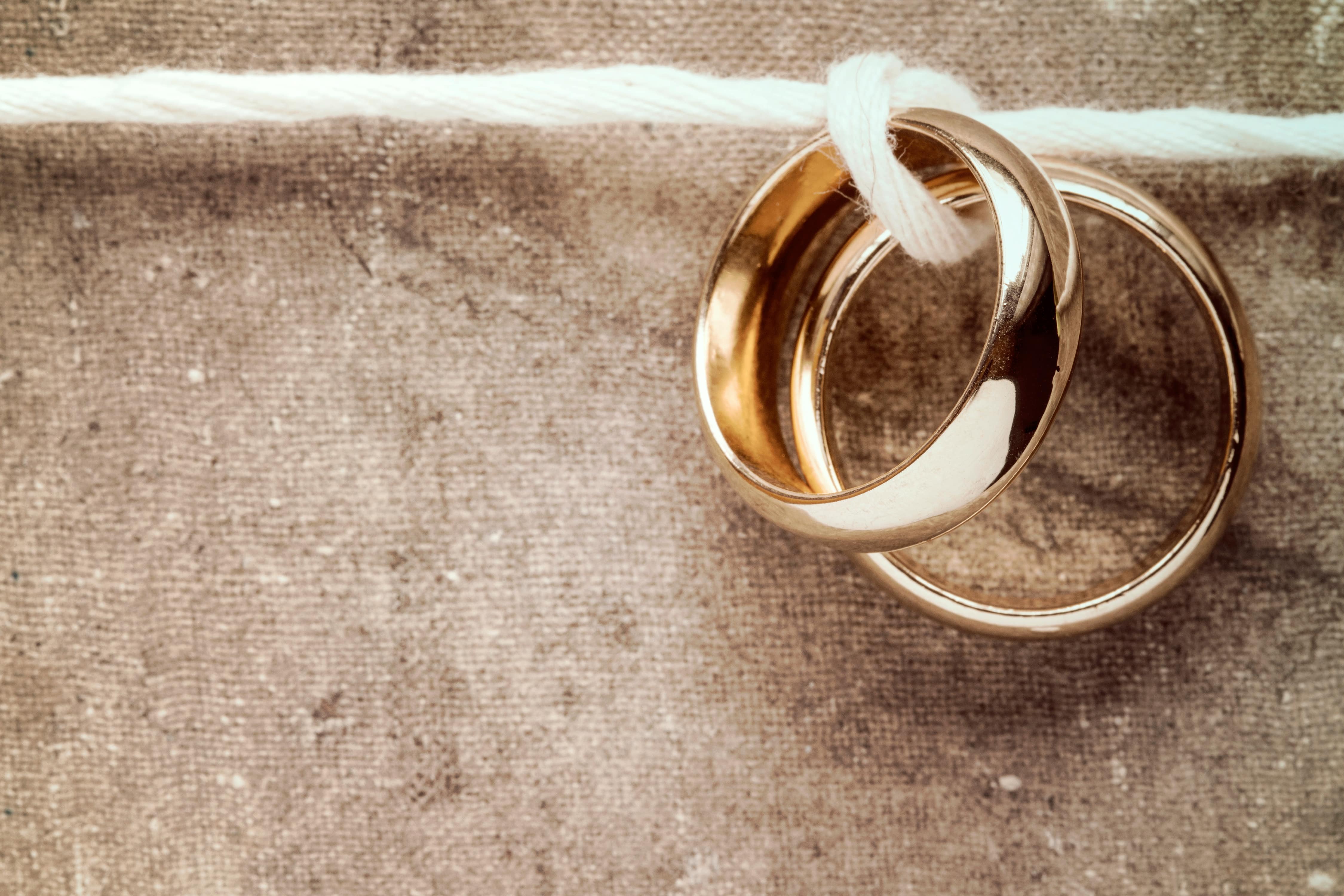 Wedding rings hanging on rope