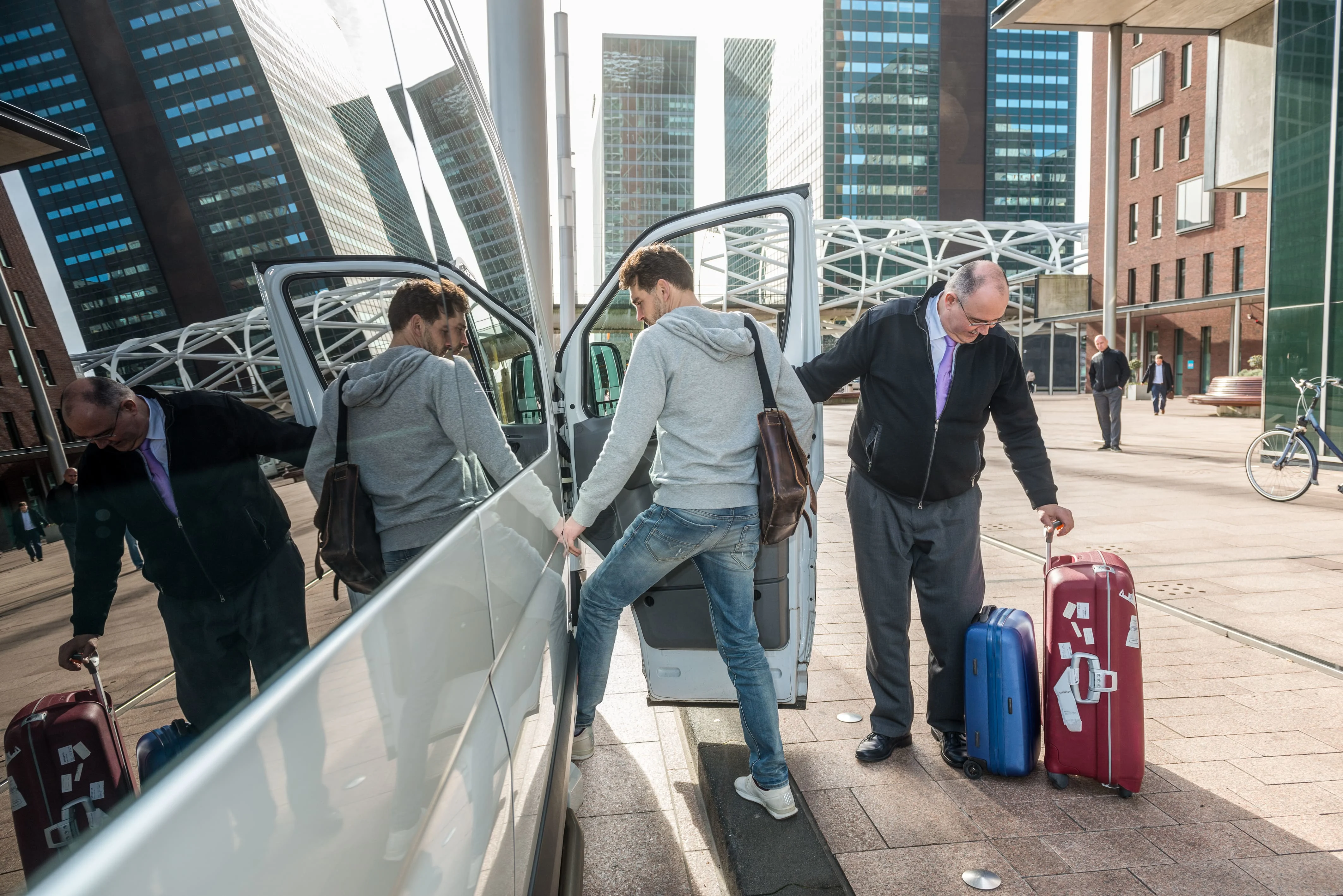 Man getting into airport taxi