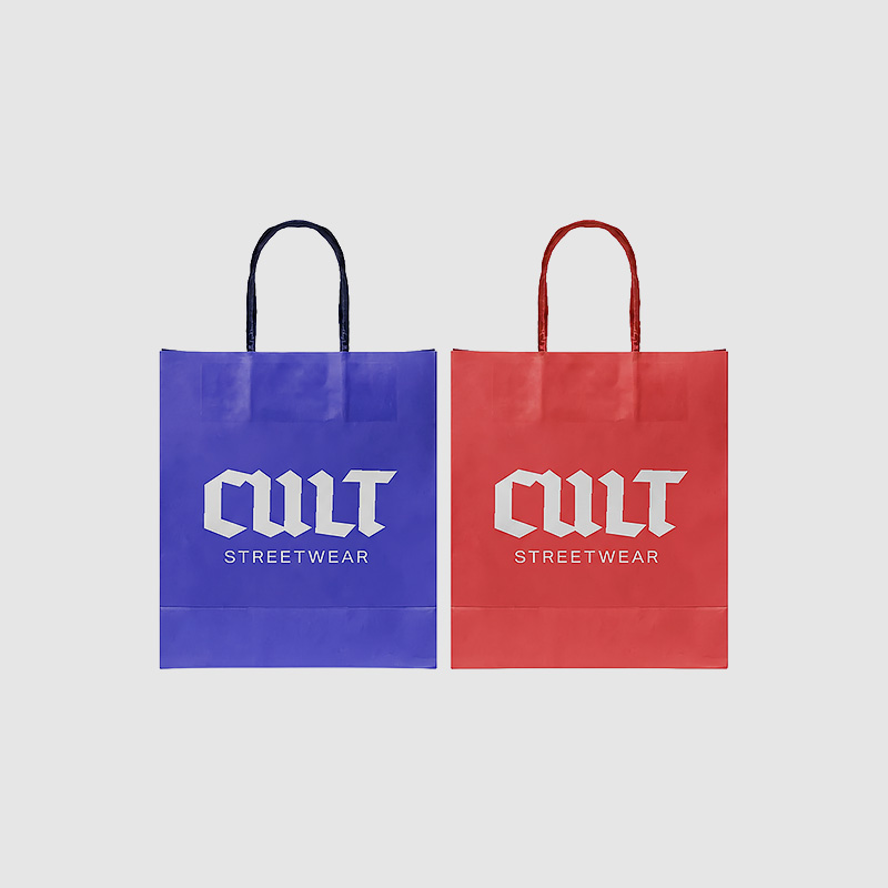 Two paper bags, one blue and one red, with a white "Cult" design.