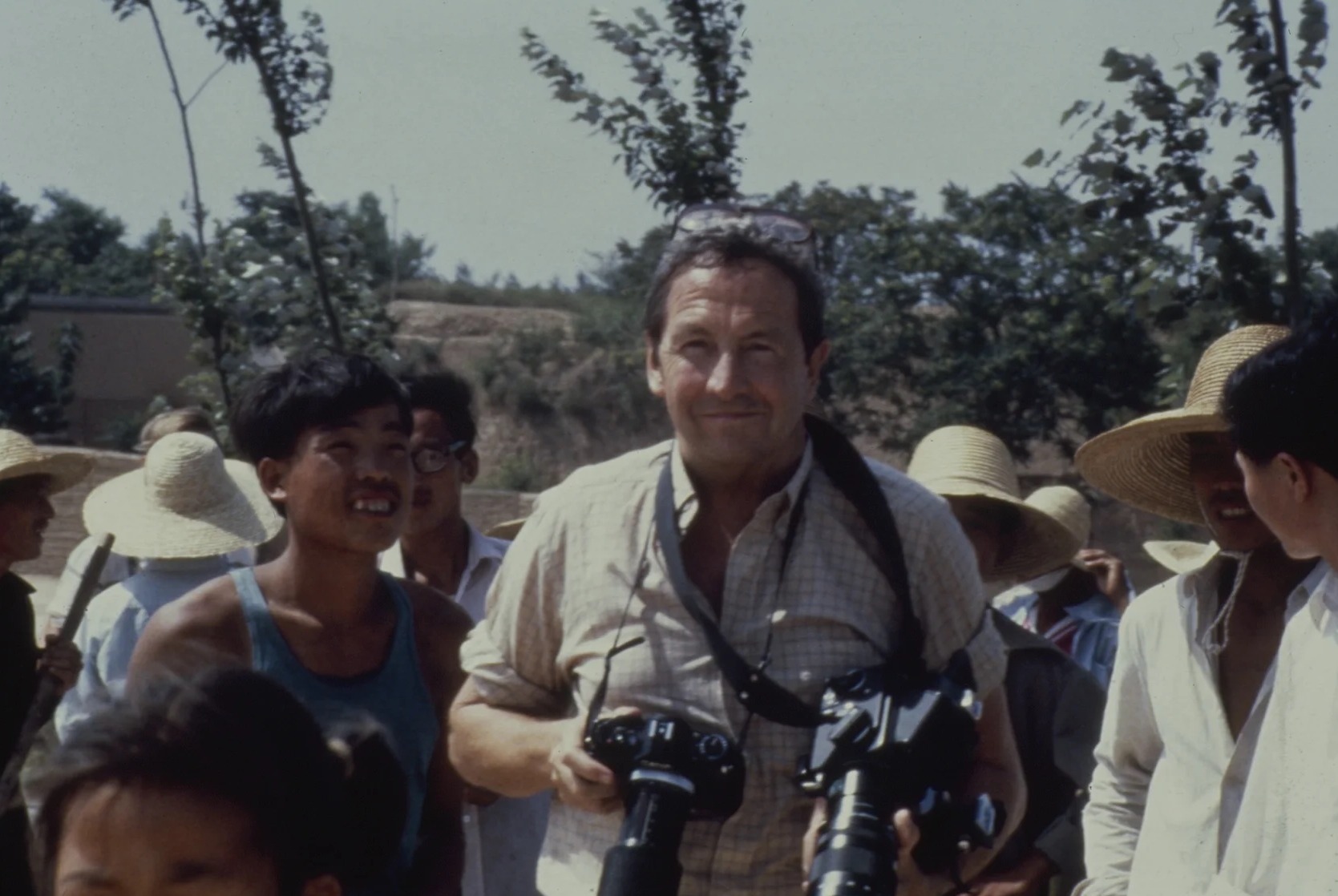 Robert Rauschenberg on the road to the world’s oldest paper mill in Anhui, taking photographs for his hundred-foot colour photo Chinese Summerhall, 1982. Donald Saff records on Rauschenberg Overseas Culture Interchange (ROCI). Robert Rauschenberg Foundation Archives, New York. Photo: Elyse Grinstein. © The Elyse Grinstein Estate. Image courtesy of Robert Rauschenberg Foundation