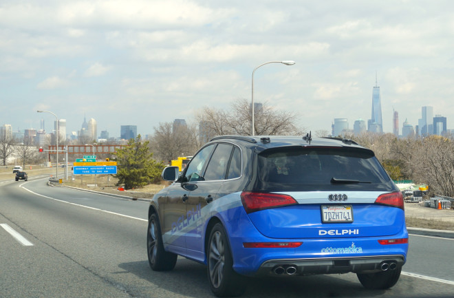 automated-driving-car-on-highway-with-new-york-city-background.jpg