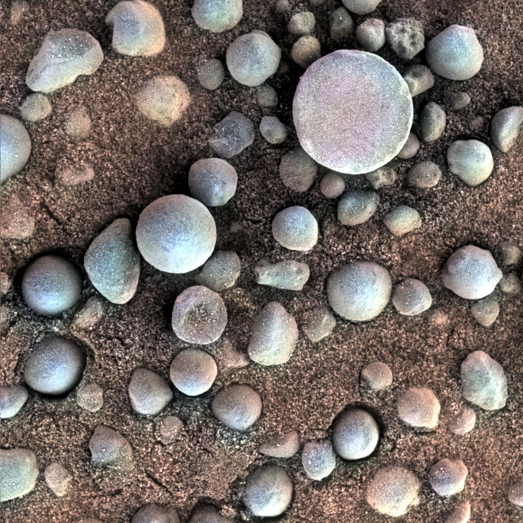 a pile of small round blue stones