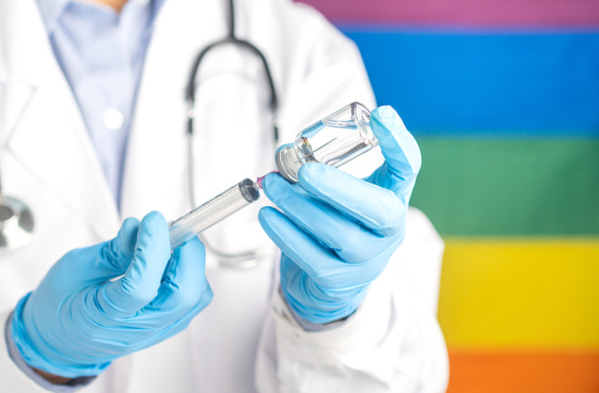 LGBTQ flag and covid vaccine - shutterstock 1968359242 (1)